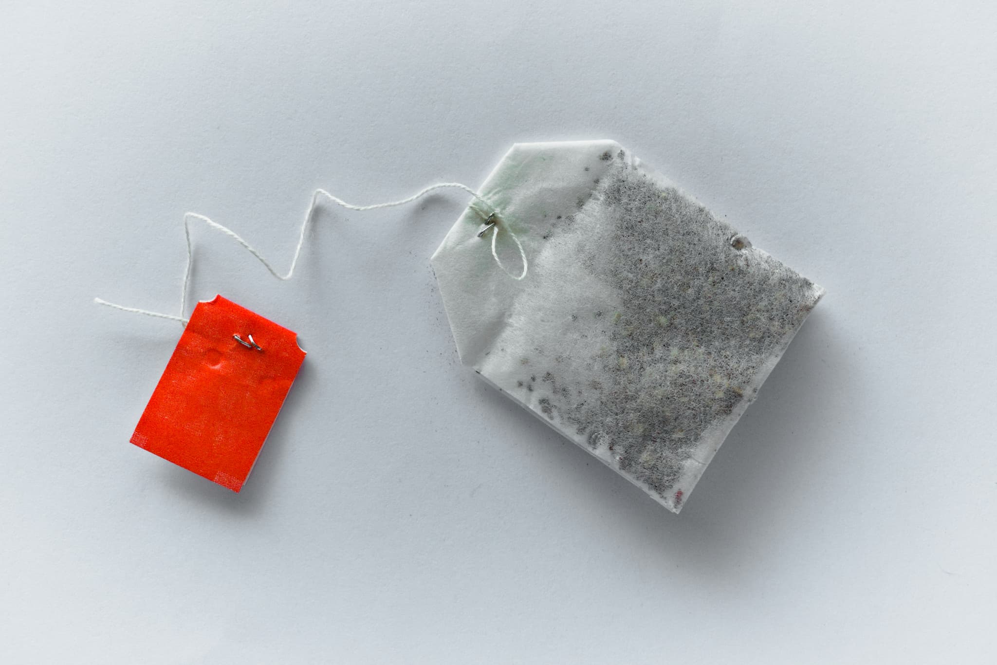 Tea bag in a cup of hot water